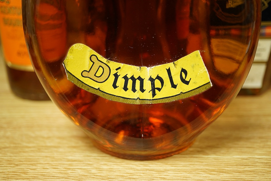 A bottle of Dimple whisky, Old Grand-Dad Bourbon whiskey and Stewarts Cream of the Barley
